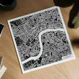London Map Black by Laura Marshall. Shown as a detailed flat fine art print, highlighting archival giclee quality. Available as an archival giclee rolled canvas, fine art paper, or poster print. SKU 60392a.