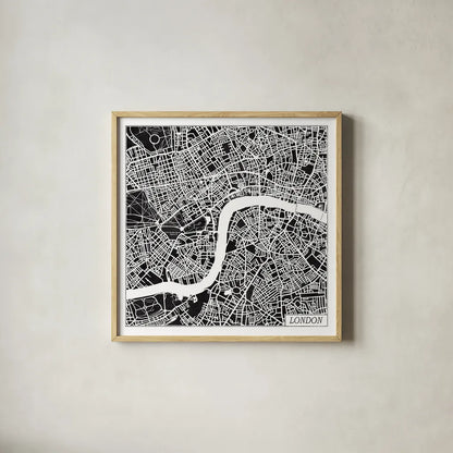 London Map Black by Laura Marshall. Shown in a natural wood glass frame for a timeless modern aesthetic. Available as an archival giclee rolled canvas, fine art paper, or poster print. SKU 60392a.