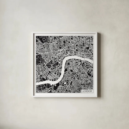London Map Black by Laura Marshall. Shown in a crisp white glass frame for a clean and minimalist style. Available as an archival giclee rolled canvas, fine art paper, or poster print. SKU 60392a.