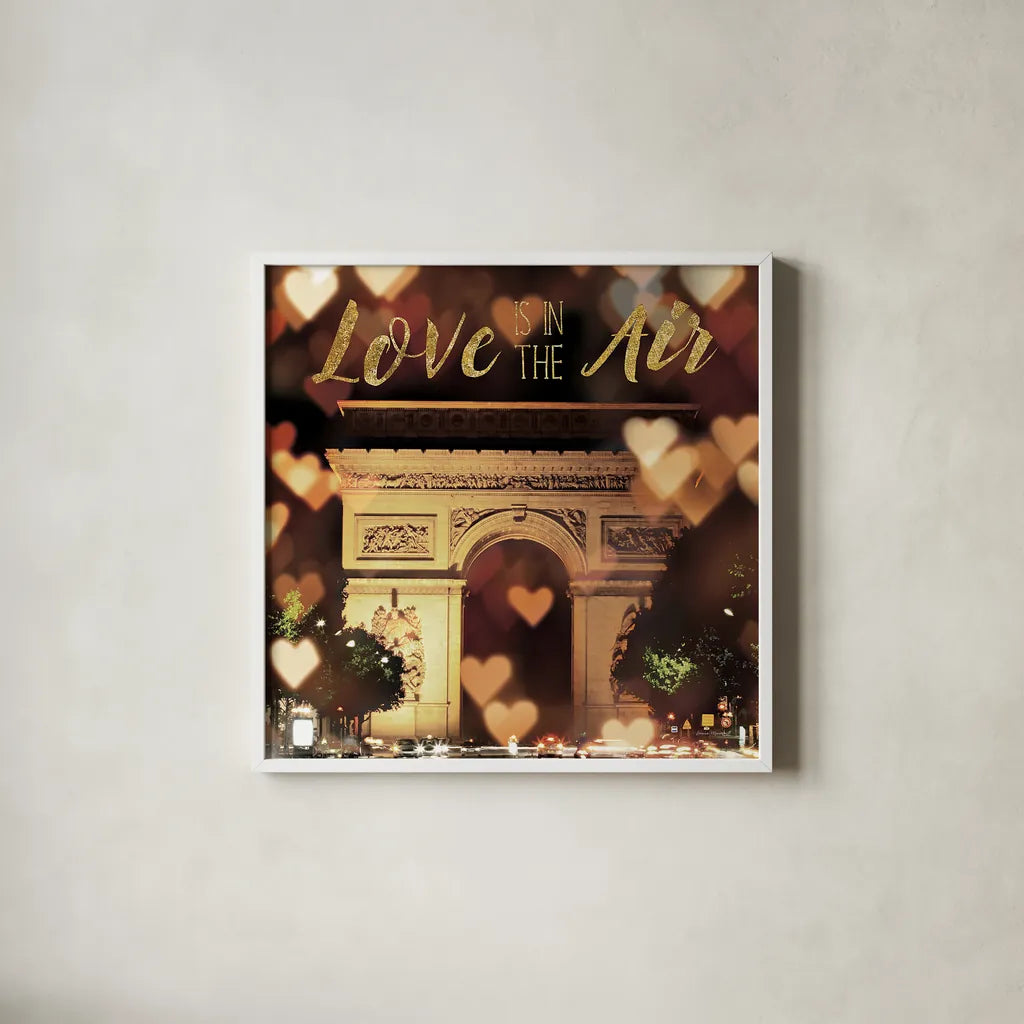 Love is in the Air Arc de Triomphe by Laura Marshall. Shown in a crisp white glass frame for a clean and minimalist style. Available as an archival giclee rolled canvas, fine art paper, or poster print. SKU 32258a.