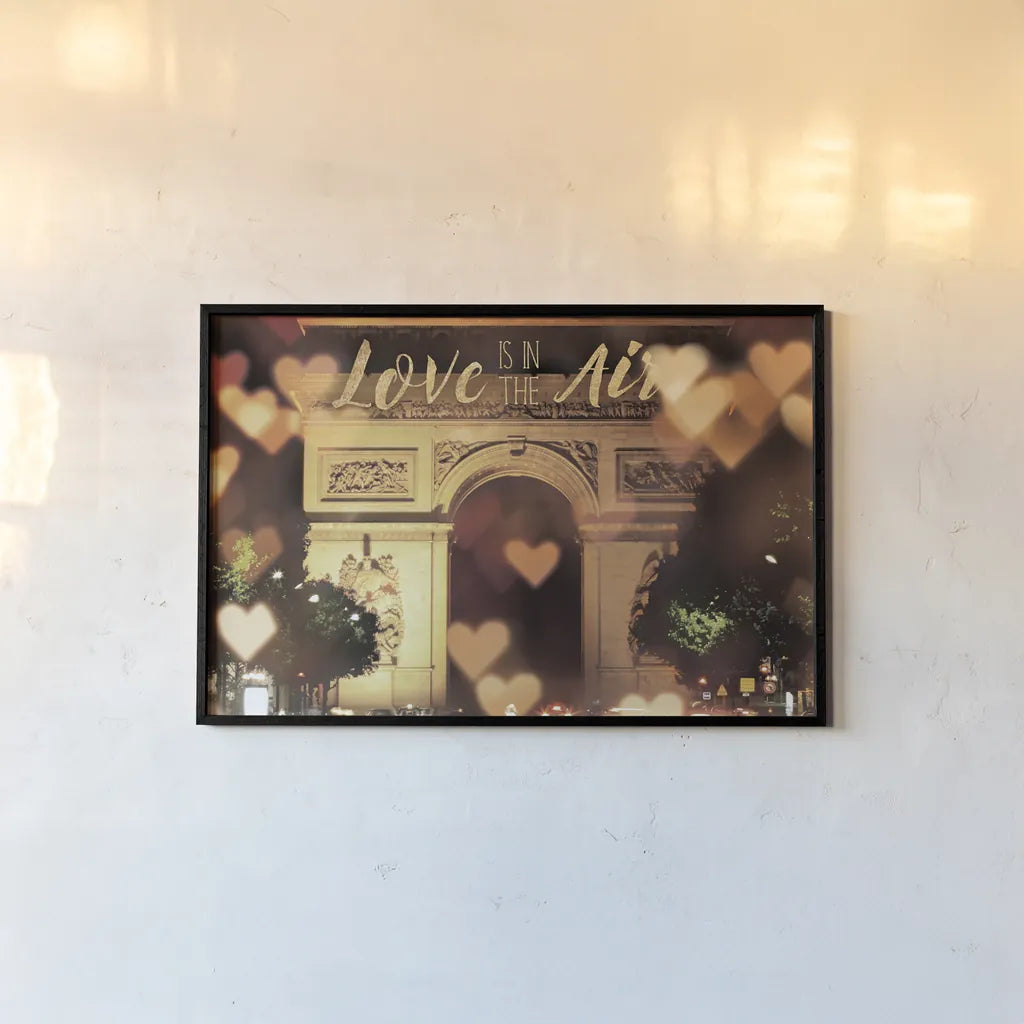 Love is in the Arc de Triomphe v2 by Laura Marshall. shown as a paper print in a black flame. Available as a archival giclee rolled canvas, fine art paper, or poster print. SKU 36980i.