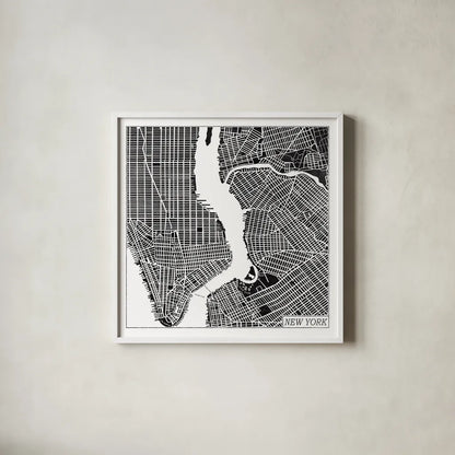 New York Map Black by Laura Marshall. Shown in a crisp white glass frame for a clean and minimalist style. Available as an archival giclee rolled canvas, fine art paper, or poster print. SKU 60390a.
