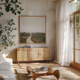 Off the Beaten Path by Laura Marshall. Shown in a natural wood frame in a cozy modern living room. Available as an archival giclee rolled canvas, fine art paper, or poster print. SKU 38774a.