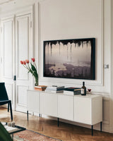 Painted Seaside I on Black by Laura Marshall. shown as a framed stretched canvas in a living room above a console. Available as a archival giclee rolled canvas, fine art paper, or poster print. SKU 29863i.