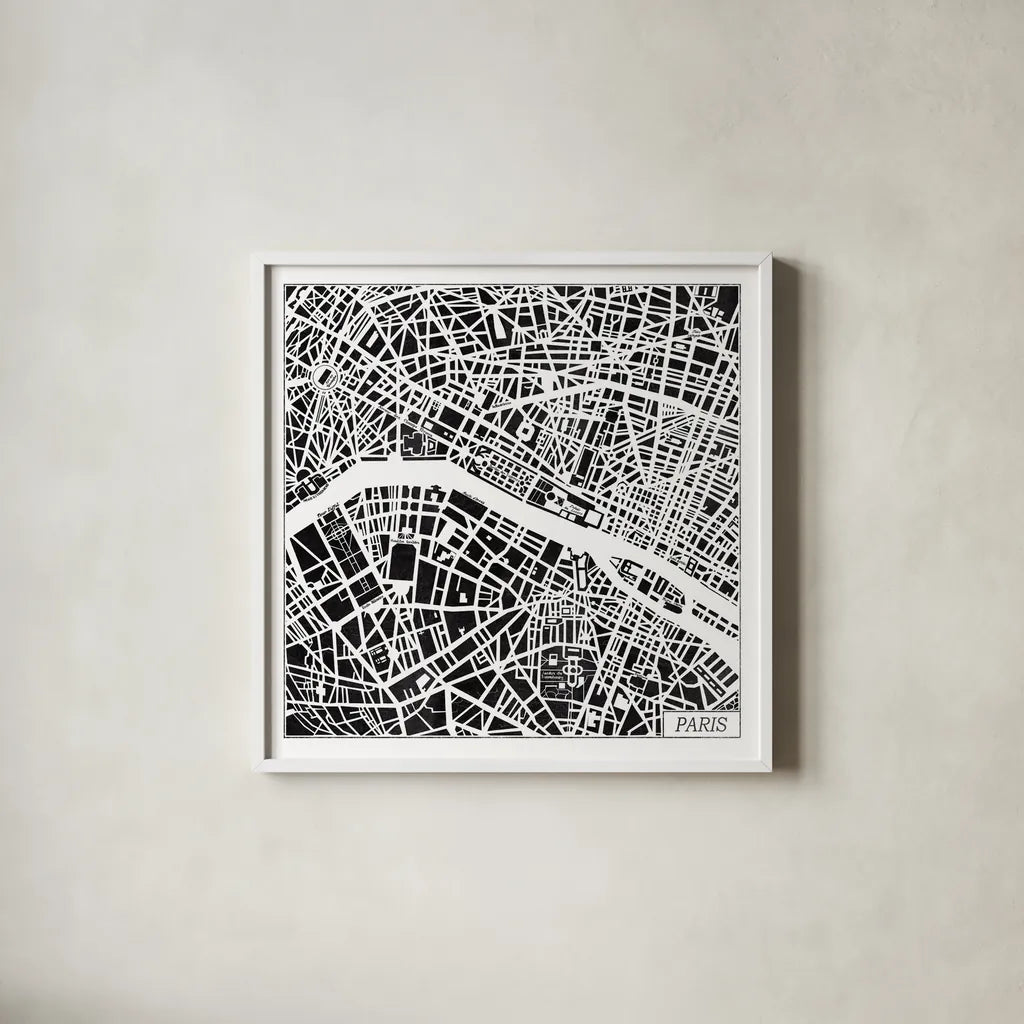 Paris Map Black by Laura Marshall. Shown in a crisp white glass frame for a clean and minimalist style. Available as an archival giclee rolled canvas, fine art paper, or poster print. SKU 60391a.