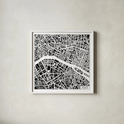 Paris Map Black by Laura Marshall. Shown in a crisp white glass frame for a clean and minimalist style. Available as an archival giclee rolled canvas, fine art paper, or poster print. SKU 60391a.