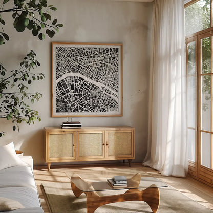 Paris Map Black by Laura Marshall. Shown in a natural wood frame in a cozy modern living room. Available as an archival giclee rolled canvas, fine art paper, or poster print. SKU 60391a.