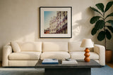 Paris Moments III by Laura Marshall. Displayed in a glass frame with matte in a clean modern living room. Available as an archival giclee rolled canvas, fine art paper, or poster print. SKU 25891a.