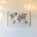 Pattern World Map by Laura Marshall. shown as a paper print in a white frame. Available as a archival giclee rolled canvas, fine art paper, or poster print. SKU 22904i.
