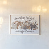 Pumpkins and Paws I by Laura Marshall. shown as a paper print in a white frame. Available as a archival giclee rolled canvas, fine art paper, or poster print. SKU 95559i.
