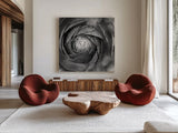 Ranunculus Abstract I BW by Laura Marshall. Shown as extra-large giant wall art in a modern living room. Available as an archival giclee rolled canvas, fine art paper, or poster print. SKU 25284a.