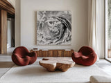 Ranunculus Abstract IV BW Light by Laura Marshall. Shown as extra-large giant wall art in a modern living room. Available as an archival giclee rolled canvas, fine art paper, or poster print. SKU 43249a.