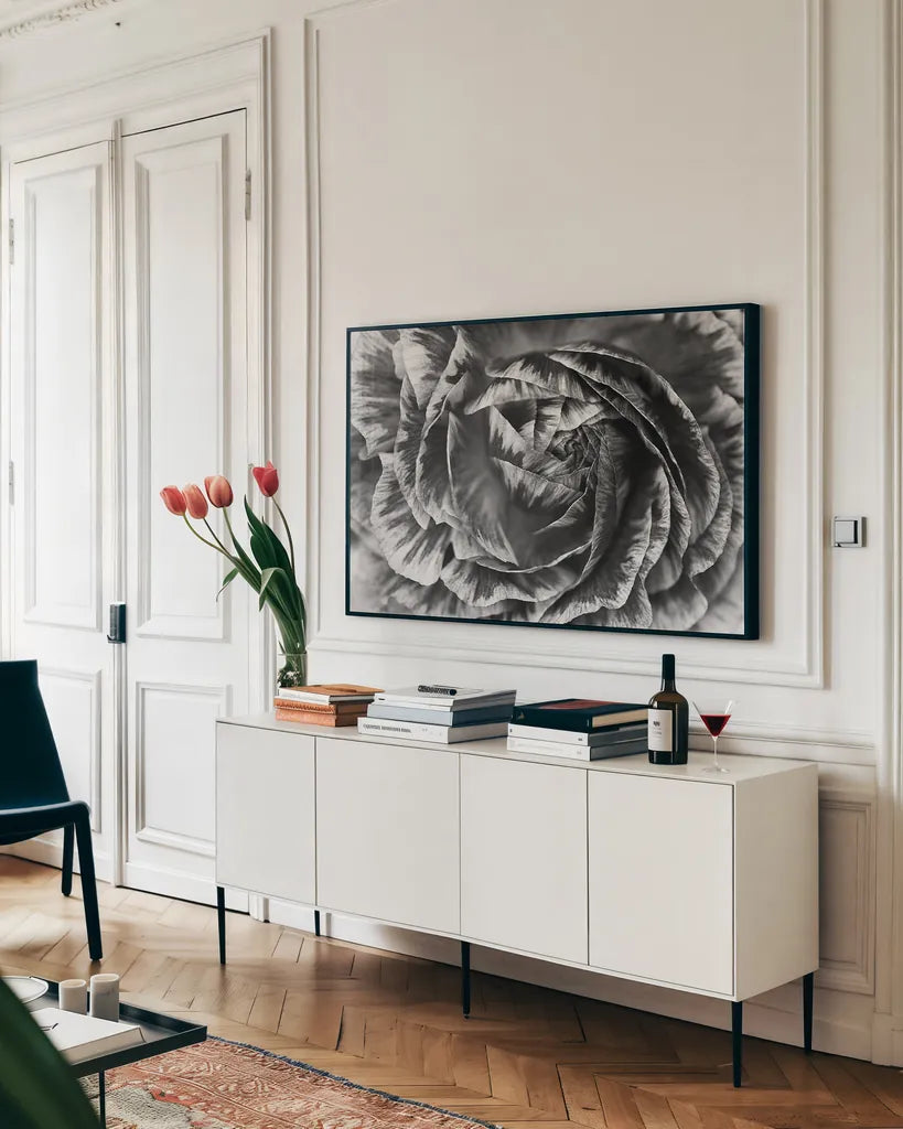 Ranunculus Abstract VI BW by Laura Marshall. shown as a framed stretched canvas in a living room above a console. Available as a archival giclee rolled canvas, fine art paper, or poster print. SKU 25289i.