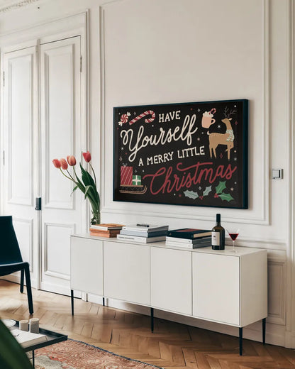 Reindeer Holiday I Black by Laura Marshall. shown as a framed stretched canvas in a living room above a console. Available as a archival giclee rolled canvas, fine art paper, or poster print. SKU 75794i.