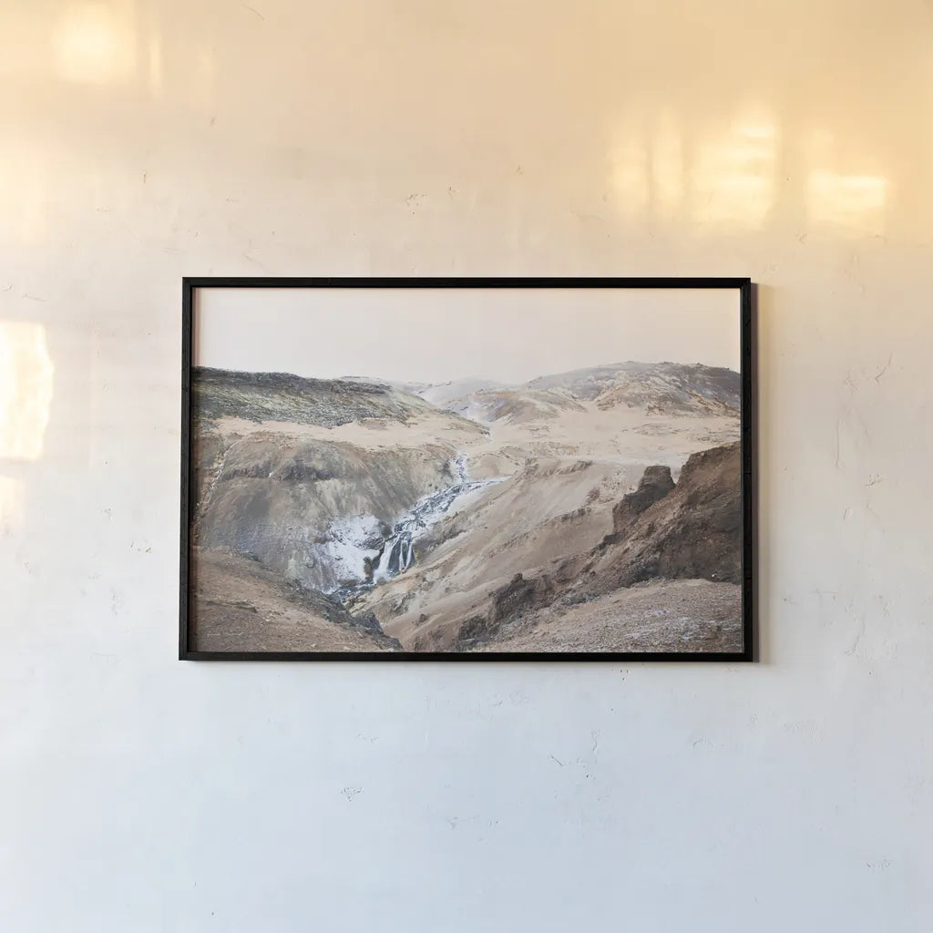 Reykjadalur Hot River by Laura Marshall. shown as a paper print in a black flame. Available as a archival giclee rolled canvas, fine art paper, or poster print. SKU 69905i.