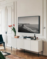 Reynisfjara by Laura Marshall. shown as a framed stretched canvas in a living room above a console. Available as a archival giclee rolled canvas, fine art paper, or poster print. SKU 64400i.