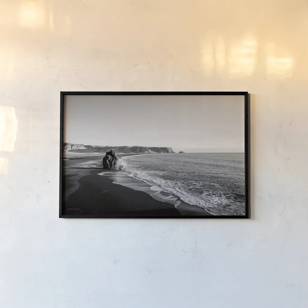 Reynisfjara by Laura Marshall. shown as a paper print in a black flame. Available as a archival giclee rolled canvas, fine art paper, or poster print. SKU 64400i.