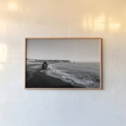 Reynisfjara by Laura Marshall. shown as a paper print in a natural frame. Available as a archival giclee rolled canvas, fine art paper, or poster print. SKU 64400i.
