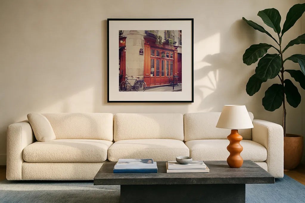 Rue Chanoinesse by Laura Marshall. Displayed in a glass frame with matte in a clean modern living room. Available as an archival giclee rolled canvas, fine art paper, or poster print. SKU 21920a.