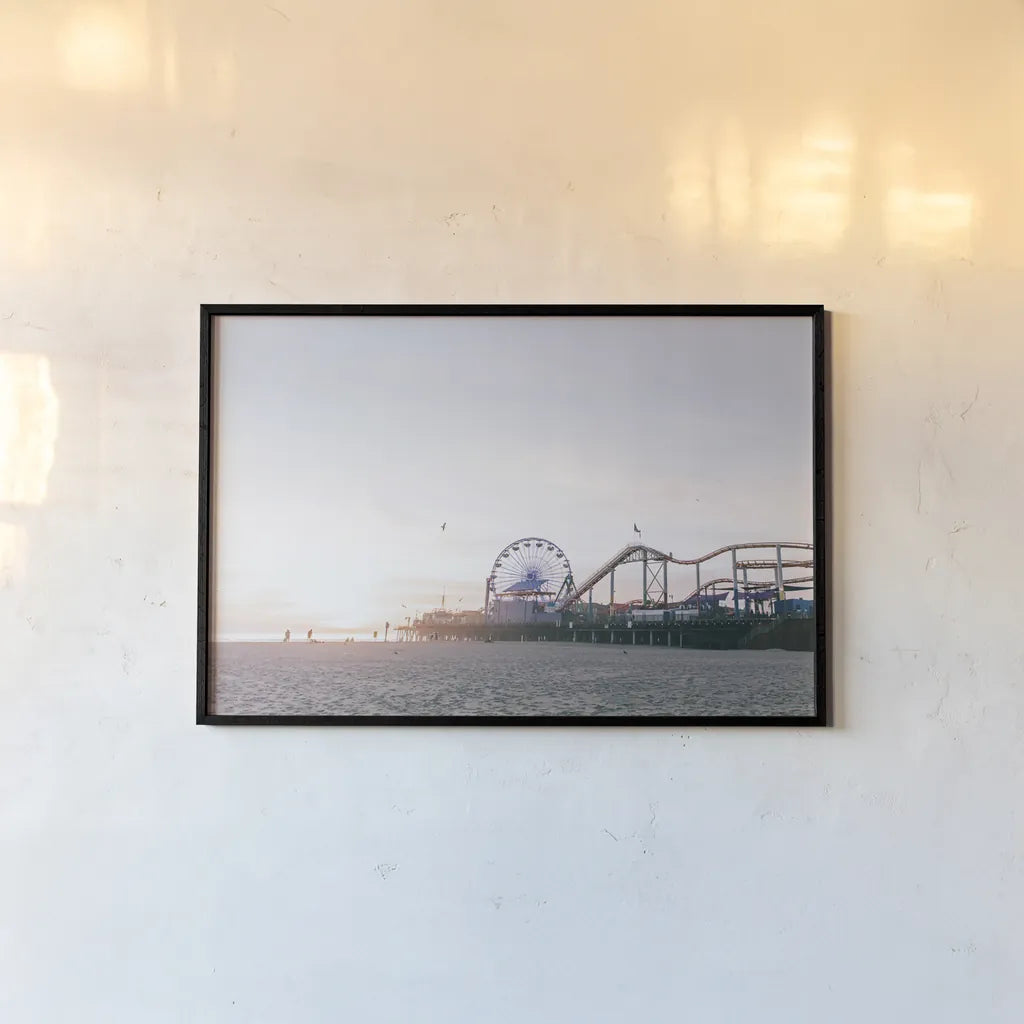 Santa Monica Pier by Laura Marshall. shown as a paper print in a black flame. Available as a archival giclee rolled canvas, fine art paper, or poster print. SKU 81306i.