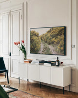 Scottish Highlands II by Laura Marshall. shown as a framed stretched canvas in a living room above a console. Available as a archival giclee rolled canvas, fine art paper, or poster print. SKU 63276i.