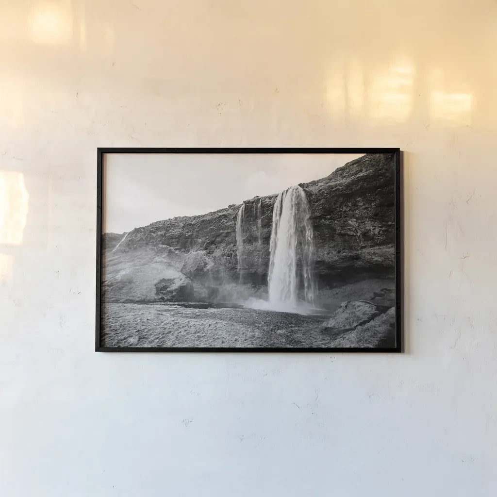 Seljalandsfoss by Laura Marshall. shown as a paper print in a black flame. Available as a archival giclee rolled canvas, fine art paper, or poster print. SKU 64395i.
