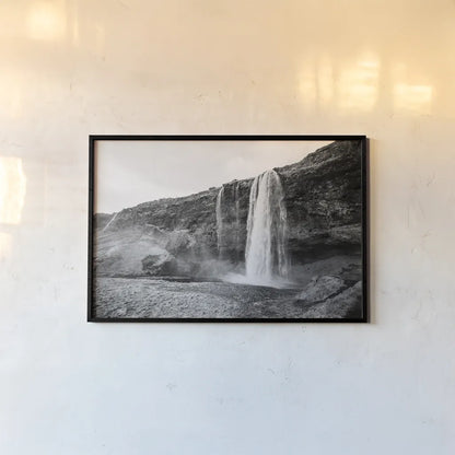 Seljalandsfoss by Laura Marshall. shown as a paper print in a black flame. Available as a archival giclee rolled canvas, fine art paper, or poster print. SKU 64395i.