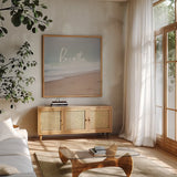 Serene Sea I by Laura Marshall. Shown in a natural wood frame in a cozy modern living room. Available as an archival giclee rolled canvas, fine art paper, or poster print. SKU 39639a.