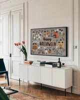 Spooky Village I Gray by Laura Marshall. shown as a framed stretched canvas in a living room above a console. Available as a archival giclee rolled canvas, fine art paper, or poster print. SKU 48104i.