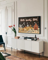 Spooky Village II by Laura Marshall. shown as a framed stretched canvas in a living room above a console. Available as a archival giclee rolled canvas, fine art paper, or poster print. SKU 48105i.