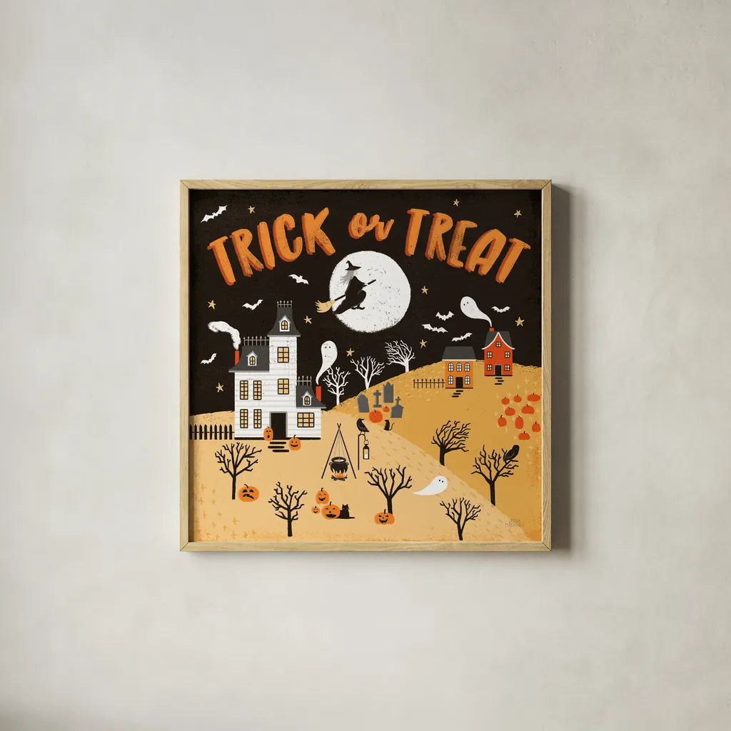 Spooky Village III Orange by Laura Marshall. Shown in a natural wood glass frame for a timeless modern aesthetic. Available as an archival giclee rolled canvas, fine art paper, or poster print. SKU 49228a.