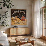 Spooky Village IV by Laura Marshall. Shown in a natural wood frame in a cozy modern living room. Available as an archival giclee rolled canvas, fine art paper, or poster print. SKU 48107a.