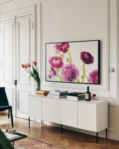 Spring Ranunculus IV by Laura Marshall. shown as a framed stretched canvas in a living room above a console. Available as a archival giclee rolled canvas, fine art paper, or poster print. SKU 25100i.