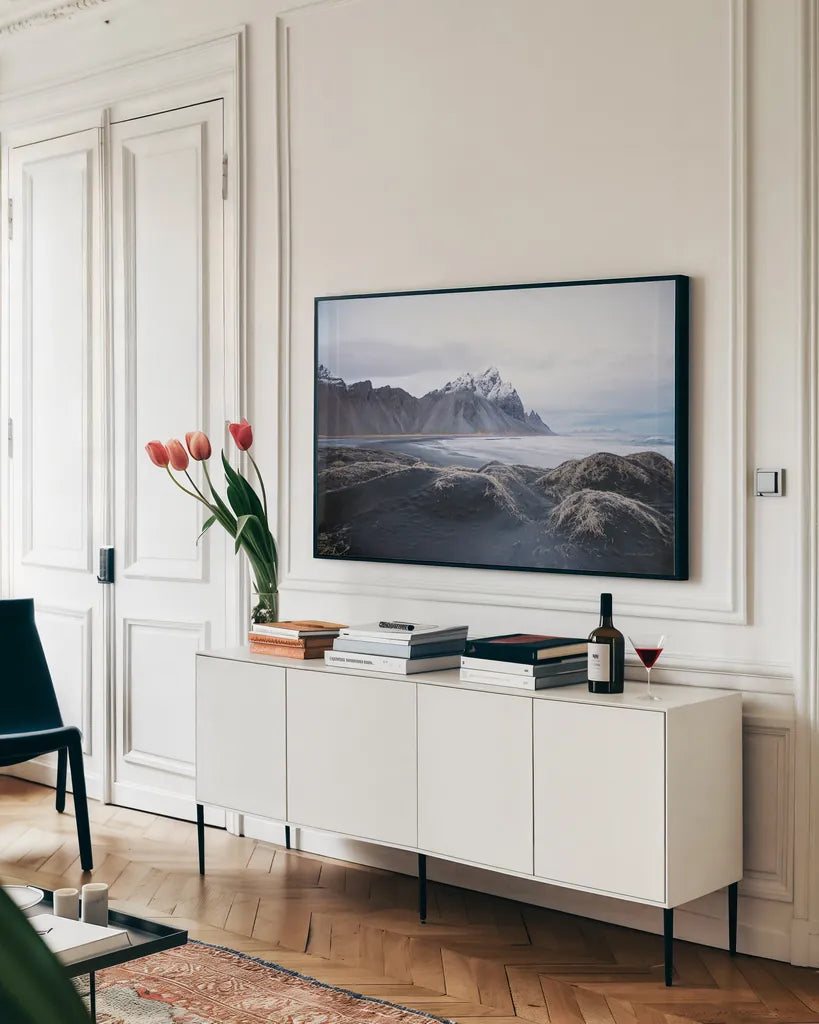 Stokksnes by Laura Marshall. shown as a framed stretched canvas in a living room above a console. Available as a archival giclee rolled canvas, fine art paper, or poster print. SKU 53677i.