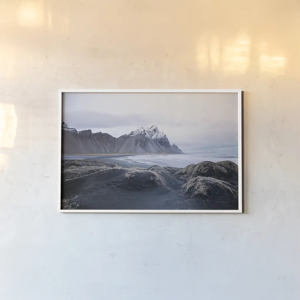 Stokksnes by Laura Marshall. shown as a paper print in a white frame. Available as a archival giclee rolled canvas, fine art paper, or poster print. SKU 53677i.