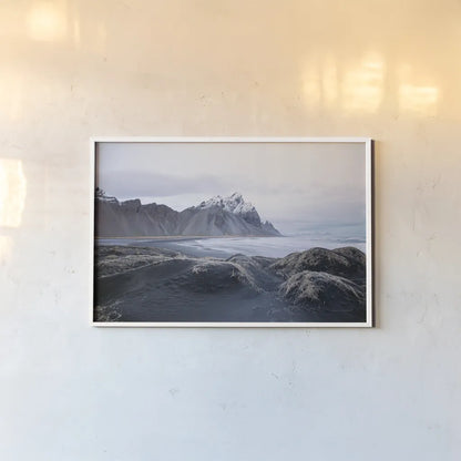 Stokksnes by Laura Marshall. shown as a paper print in a white frame. Available as a archival giclee rolled canvas, fine art paper, or poster print. SKU 53677i.