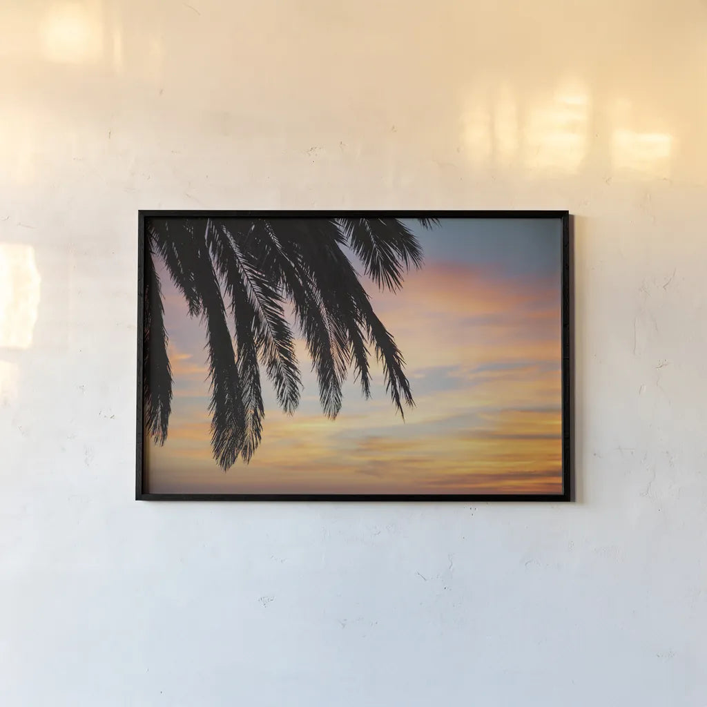 Sunset Palms I by Laura Marshall. shown as a paper print in a black flame. Available as a archival giclee rolled canvas, fine art paper, or poster print. SKU 42851i.