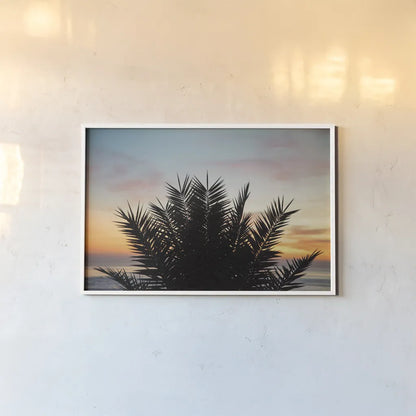Sunset Palms II by Laura Marshall. shown as a paper print in a white frame. Available as a archival giclee rolled canvas, fine art paper, or poster print. SKU 42852i.
