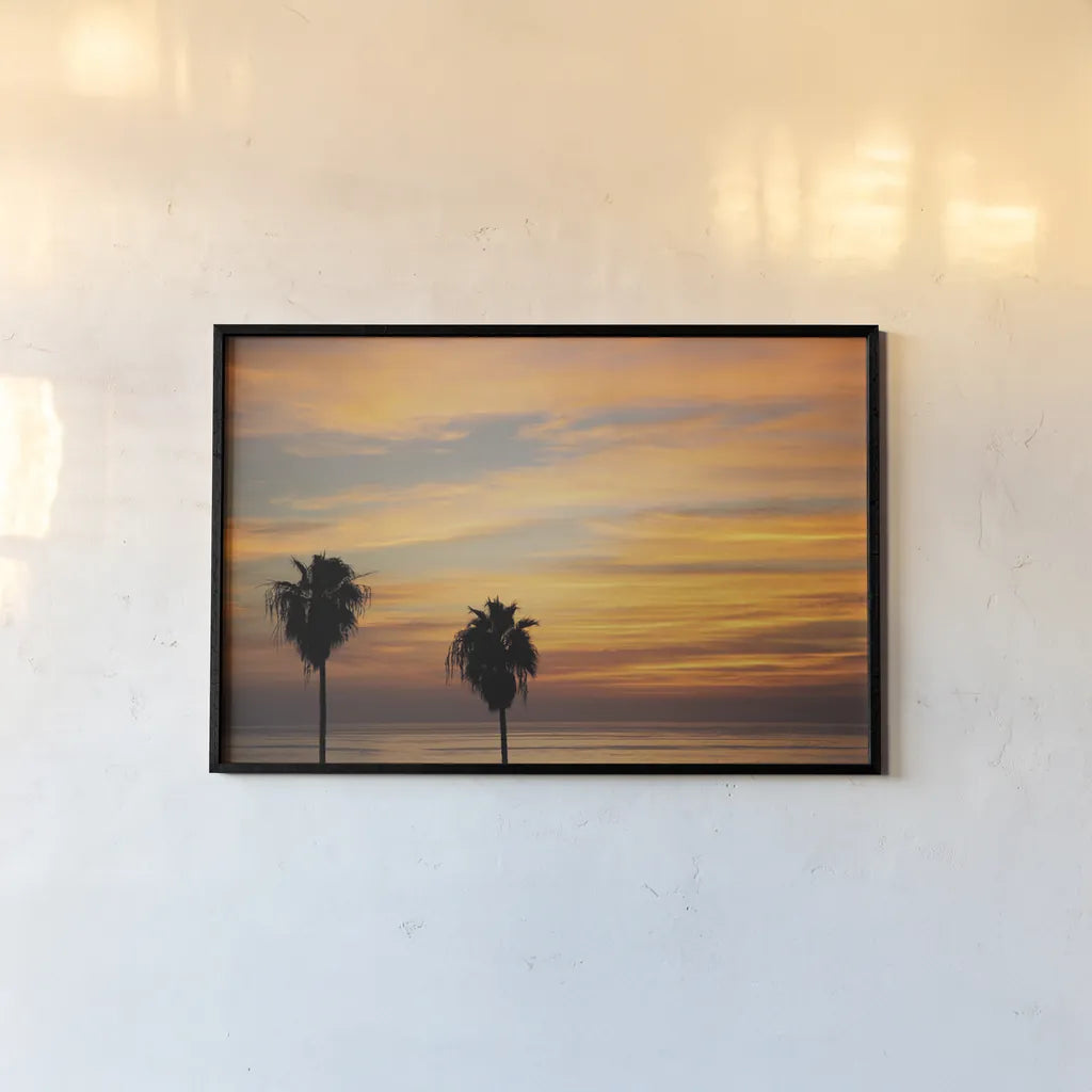 Sunset Palms III by Laura Marshall. shown as a paper print in a black flame. Available as a archival giclee rolled canvas, fine art paper, or poster print. SKU 42853i.