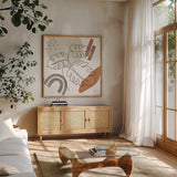 Terracotta Tropics I by Laura Marshall. Shown in a natural wood frame in a cozy modern living room. Available as an archival giclee rolled canvas, fine art paper, or poster print. SKU 56530a.