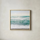 The Beach is Calling by Laura Marshall. Shown in a natural wood glass frame for a timeless modern aesthetic. Available as an archival giclee rolled canvas, fine art paper, or poster print. SKU 21117a.