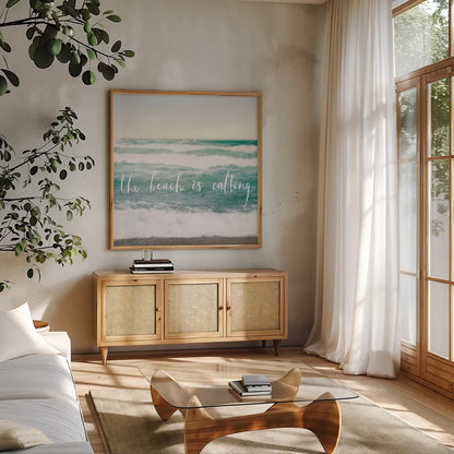 The Beach is Calling by Laura Marshall. Shown in a natural wood frame in a cozy modern living room. Available as an archival giclee rolled canvas, fine art paper, or poster print. SKU 21117a.