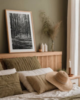 Through the Woods by Laura Marshall. shown as a paper print in a natural frame. Available as a archival giclee rolled canvas, fine art paper, or poster print. SKU 17700h.