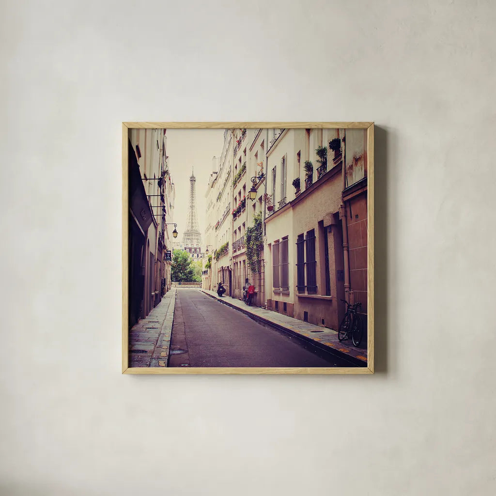 Tour Eiffel by Laura Marshall. Shown in a natural wood glass frame for a timeless modern aesthetic. Available as an archival giclee rolled canvas, fine art paper, or poster print. SKU 21921a.