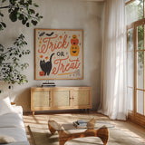Trick or Treat II with Black by Laura Marshall. Shown in a natural wood frame in a cozy modern living room. Available as an archival giclee rolled canvas, fine art paper, or poster print. SKU 74800a.