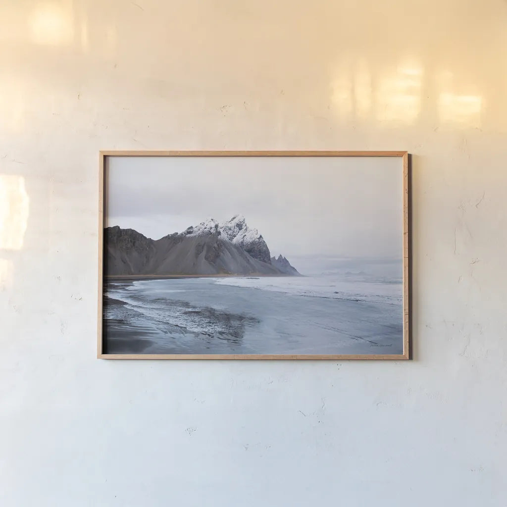 Vestrahorn by Laura Marshall. shown as a paper print in a natural frame. Available as a archival giclee rolled canvas, fine art paper, or poster print. SKU 53846i.