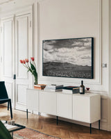 Virgin Mountains I by Laura Marshall. shown as a framed stretched canvas in a living room above a console. Available as a archival giclee rolled canvas, fine art paper, or poster print. SKU 64420i.