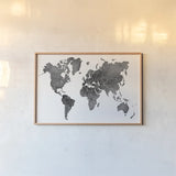 Watercolor Wanderlust Black by Laura Marshall. shown as a paper print in a natural frame. Available as a archival giclee rolled canvas, fine art paper, or poster print. SKU 50561i.