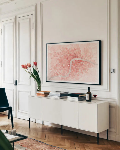 Watercolor Wanderlust London Coral by Laura Marshall. shown as a framed stretched canvas in a living room above a console. Available as a archival giclee rolled canvas, fine art paper, or poster print. SKU 50415i.