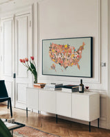 Wild Garden USA by Laura Marshall. shown as a framed stretched canvas in a living room above a console. Available as a archival giclee rolled canvas, fine art paper, or poster print. SKU 49065i.